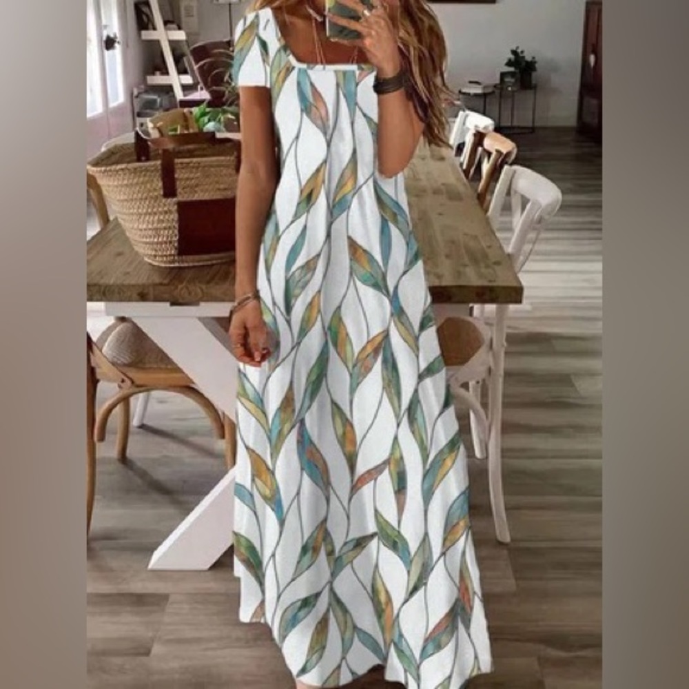 Summer dress. White with pastel colors.